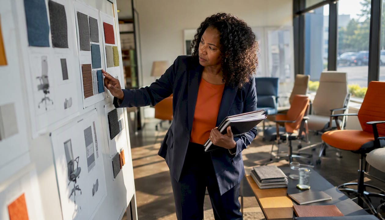 Procurement manager reviewing fabric office chairs
