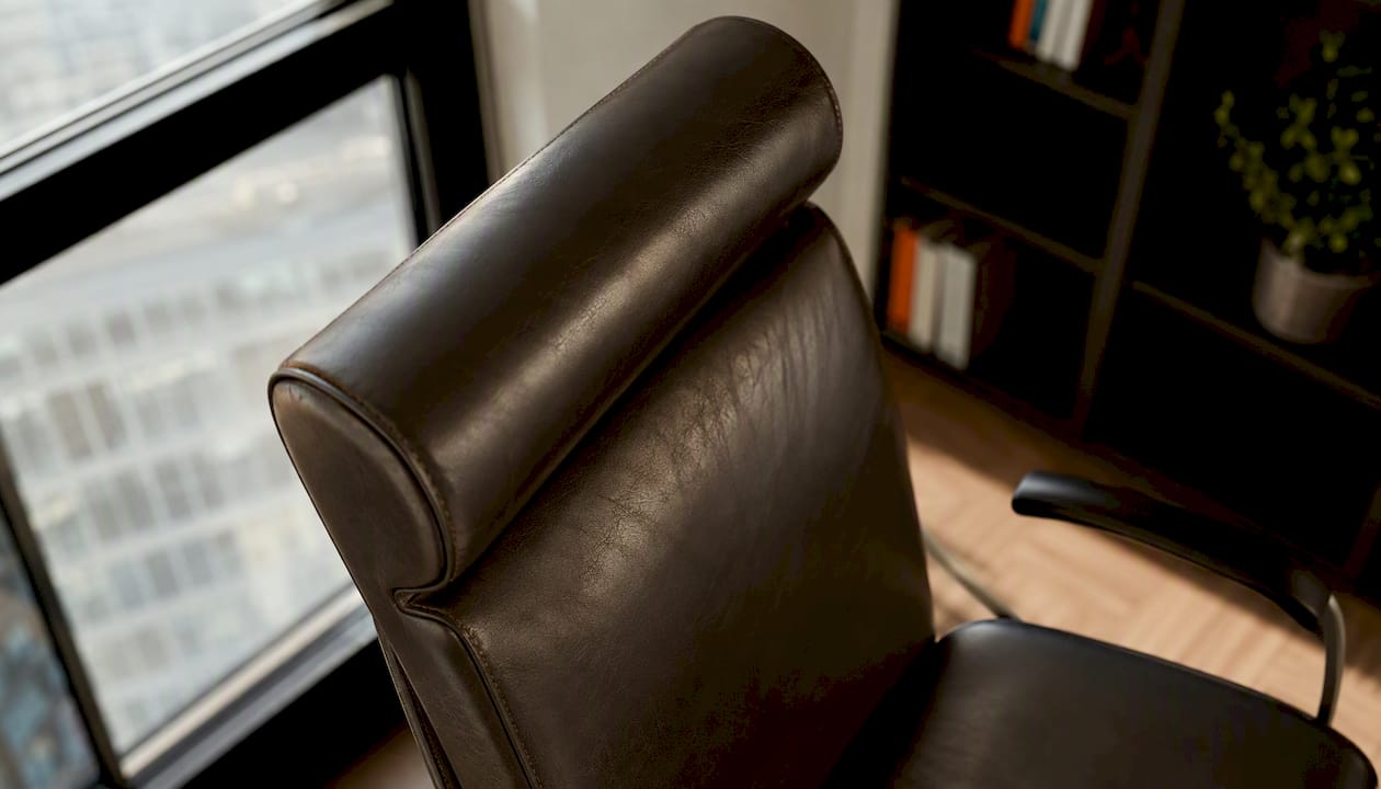 Close-up side view of executive leather office chair backrest