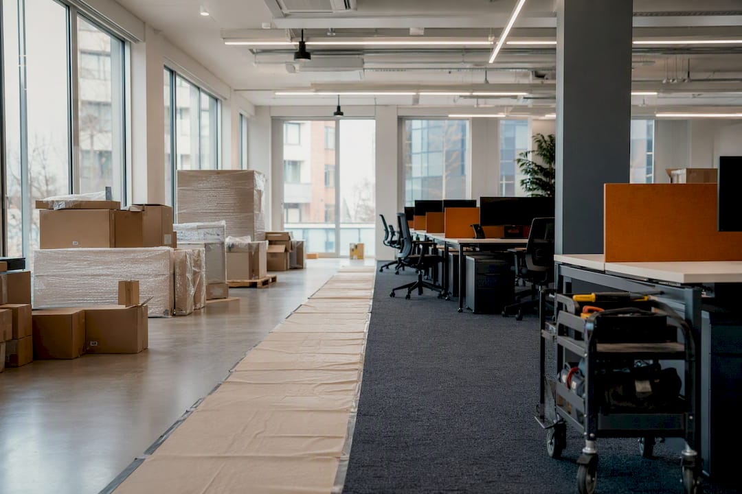 Office showing staged furniture installation zones